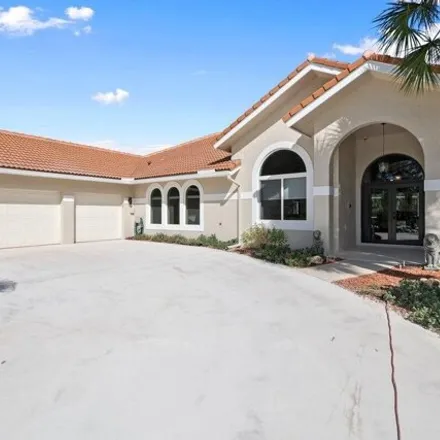 Buy this 5 bed house on 8584 Wendy Ln N in West Palm Beach, Florida