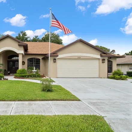 Buy this 3 bed house on 1009 Tournament Drive in Spring Hill, FL 34608