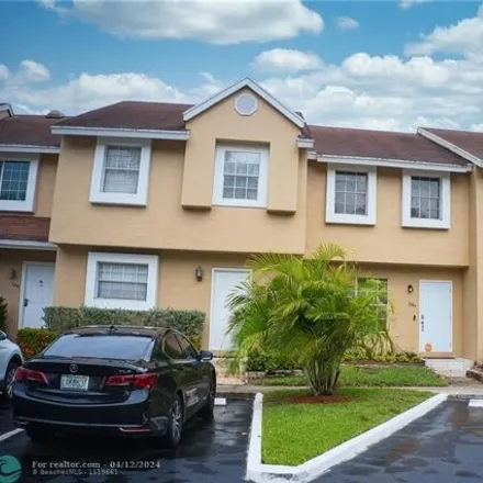 Buy this 2 bed townhouse on Woodmont Avenue in Tamarac, FL 33321