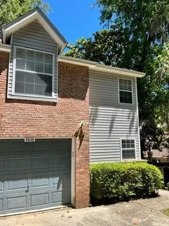 Rent this 2 bed townhouse on 3016 Camellawood Lane in Tallahassee, FL 32301