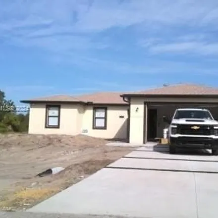 Buy this 4 bed house on 3601 E 18th St in Lehigh Acres, Florida
