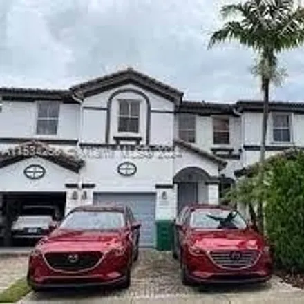 Rent this 4 bed townhouse on 7651 Northwest 114th Path in Medley, Doral