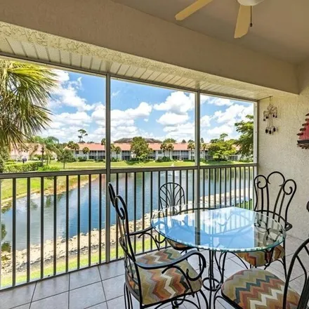 Buy this 2 bed condo on 5174 Cedar Springs Drive in Collier County, FL 34110