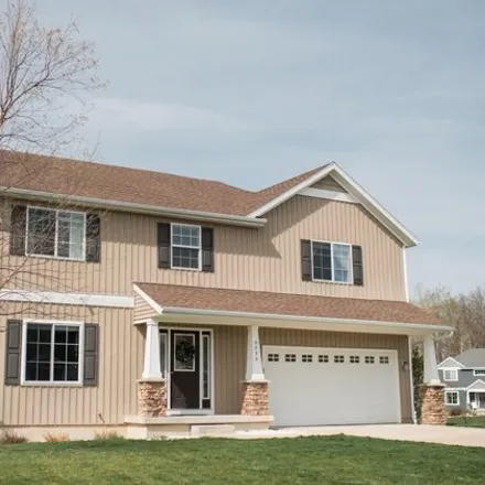 Buy this 5 bed house on 5735 Scotsglen Court Southeast in Caledonia Charter Township, MI 49316