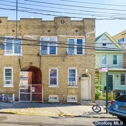 Buy this 6 bed house on 32-49 106th Street in New York, NY 11369