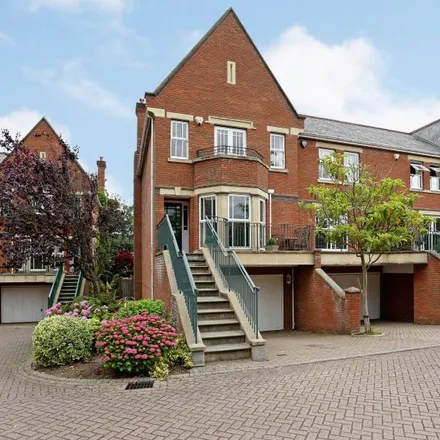 Rent this 4 bed townhouse on Cypress Court in Virginia Water, GU25 4TB