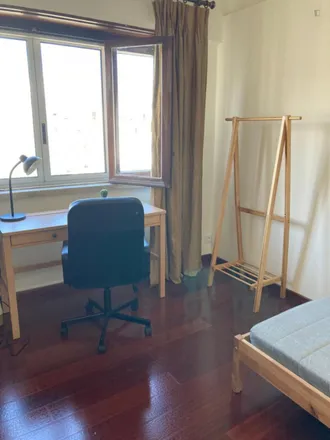 Rent this 4 bed room on Rua Doutor João Couto 13 in 1500-235 Lisbon, Portugal