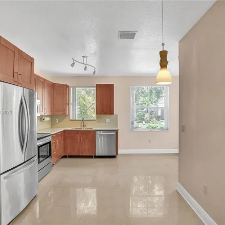 Rent this 2 bed apartment on 1590 Yellowheart Way in Hollywood, FL 33019