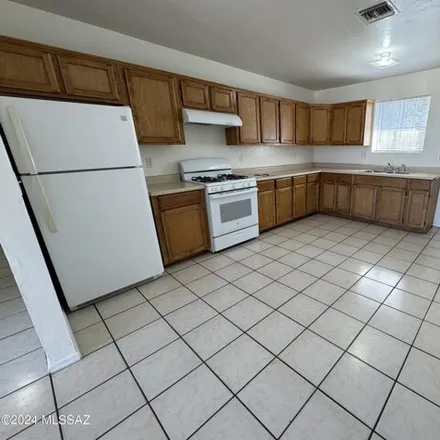 Rent this 3 bed house on 62 West Aviation Drive in Tucson, AZ 85714