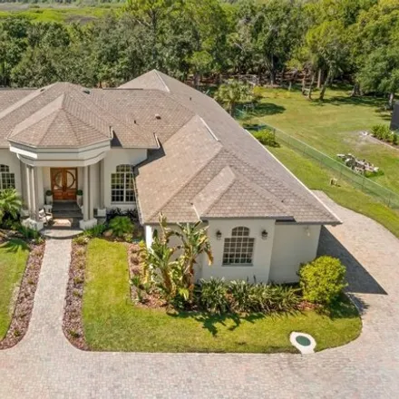Buy this 4 bed house on 12402 Memorial Highway in Oldsmar Farm, Hillsborough County