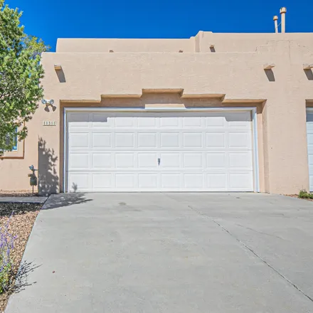 Rent this 3 bed townhouse on 11319 Campo del Oso Avenue Northeast in Albuquerque, NM 87112