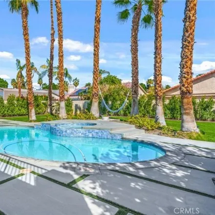 Rent this 4 bed house on 29876 Whispering Palms Trail in Cathedral City, CA 92234