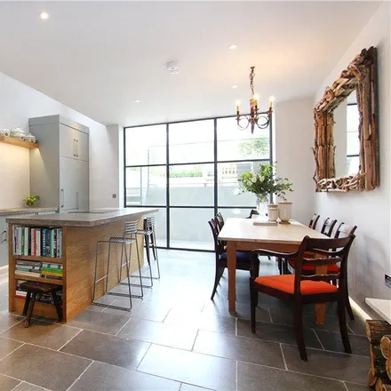 Rent this 3 bed townhouse on Farquhar Road in London, SW19 8DA