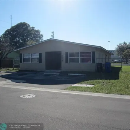 Rent this 3 bed house on William E. Dandy Middle School in 2400 Northwest 26th Street, Flamingo Village