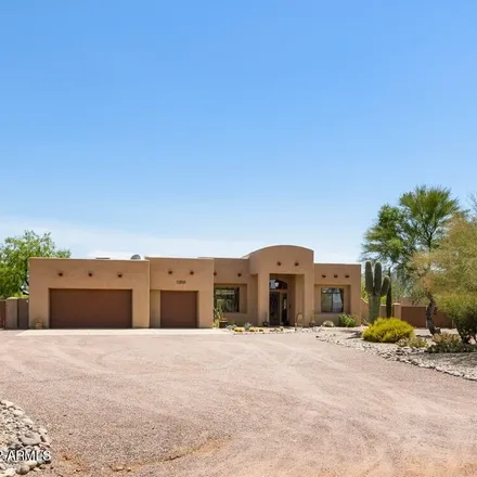 Buy this 5 bed house on East Quail Track Drive in Scottsdale, AZ