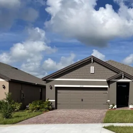 Rent this 4 bed house on Foggy Mist Road Southeast in Palm Bay, FL