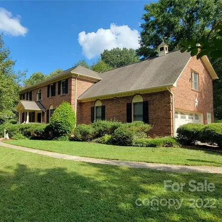 Buy this 4 bed house on 1128 Willow Oaks Trail in Weddington, NC 28104