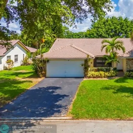 Buy this 4 bed house on 10639 Northwest 2nd Place in Coral Springs, FL 33071