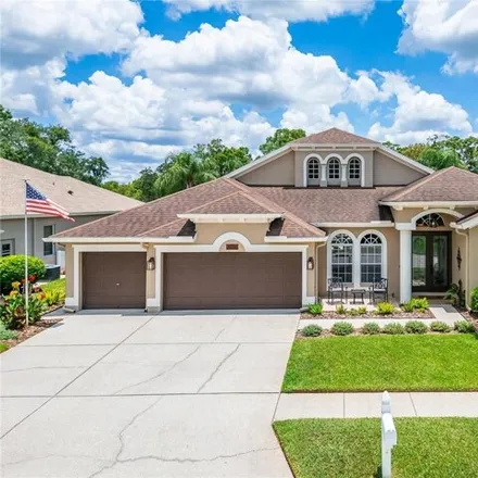 Buy this 4 bed house on 5150 Silver Charm Ter in Wesley Chapel, Florida