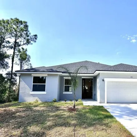 Buy this 4 bed house on 419 Flat River Street Southwest in Palm Bay, FL 32908
