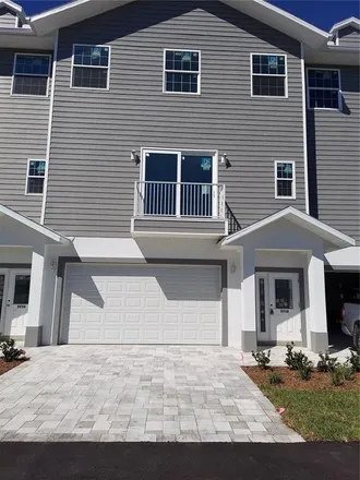 Rent this 3 bed townhouse on Bisayre court in Elfers, FL 34652