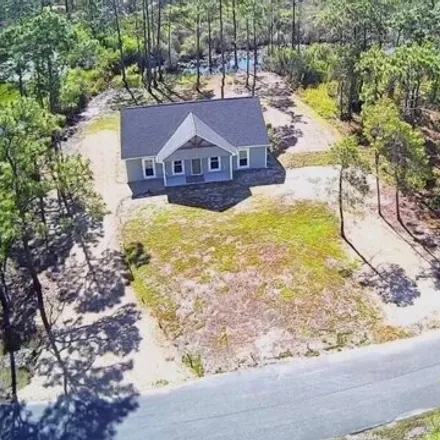 Buy this 3 bed house on 99 Shadow Bay Drive in Franklin County, FL 32328