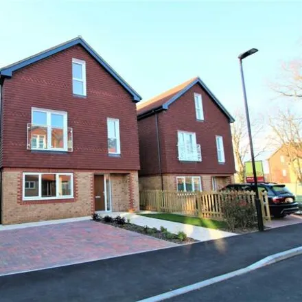 Rent this 4 bed townhouse on King Edward Close in Southwater, RH13 0ND