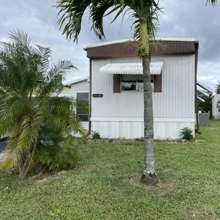 Buy this studio apartment on 4187 70th Lane North in Palm Beach County, FL 33404