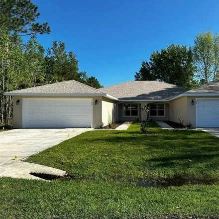 Rent this 4 bed house on 26 Buttonbush Lane in Palm Coast, FL 32137