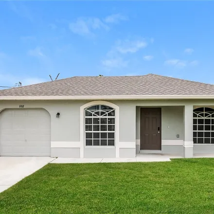 Rent this 3 bed house on 1018 Garnet Avenue in Lehigh Acres, FL 33974