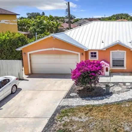 Buy this 4 bed house on 583 Southwest Baoy Avenue in Port Saint Lucie, FL 34953