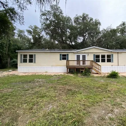 Rent this 3 bed house on Southeast 6th Avenue in Hawthorne, Alachua County