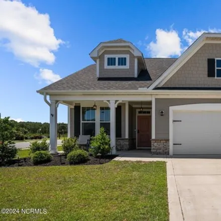 Buy this 4 bed house on Whispering Willow Cove in Leland, NC