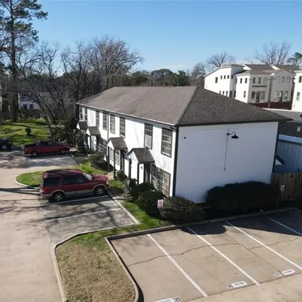 Rent this 2 bed townhouse on Cedarpost Springs Court in Houston, TX 77043