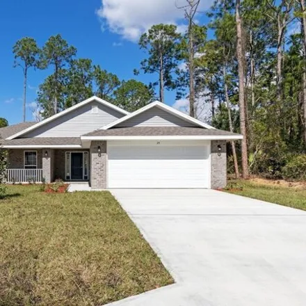 Buy this 4 bed house on 46 Point of Woods Drive in Palm Coast, FL 32164