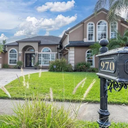 Buy this 5 bed house on 970 Parasol Place in Oviedo, FL 32766