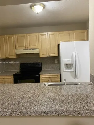 Rent this 2 bed condo on 4450 West 16th Avenue in Hialeah, FL 33012