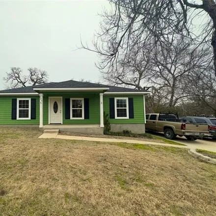 Rent this 3 bed house on 311 Poppy Avenue in Luling, TX 78648