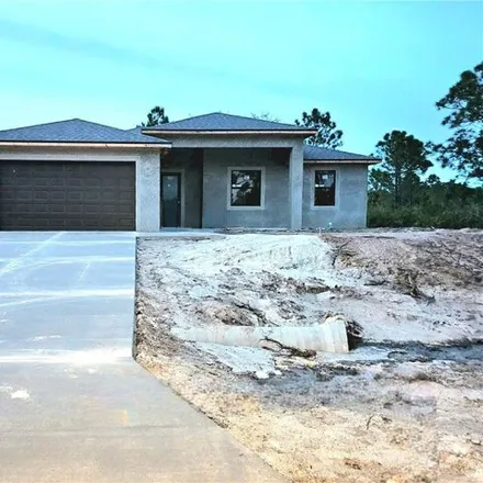 Buy this 4 bed house on 699 East 11th Street in Lehigh Acres, FL 33972