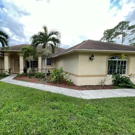 Rent this 3 bed house on 15512 Key Lime Boulevard in Palm Beach County, FL 33470