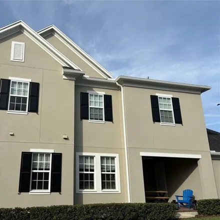 Rent this 3 bed townhouse on Island Village Way in Osceola County, FL 34896