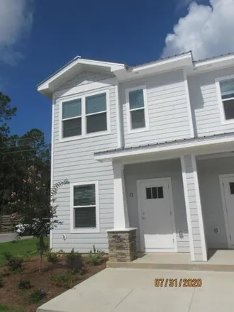 Rent this 3 bed townhouse on 73 South Sand Palm Road in Freeport, Walton County