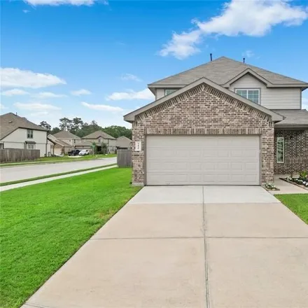 Buy this 4 bed house on Mackenzie Creek Drive in Conroe, TX