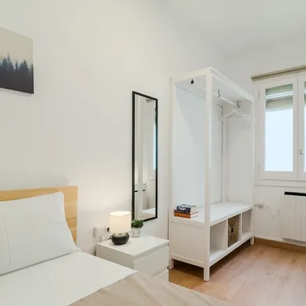 Rent this 7 bed room on idk pizza in Carrer del Rosselló, 08001 Barcelona