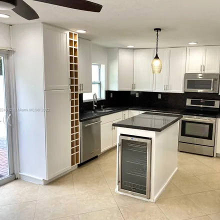 Rent this 3 bed townhouse on Woodside Drive in Coral Springs, FL 33065