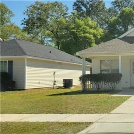 Rent this 3 bed house on 823 Willow Bridge Drive West in Pine Run, Mobile County