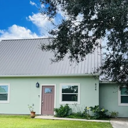Buy this 3 bed house on 820 Americana Boulevard Northwest in Palm Bay, FL 32907