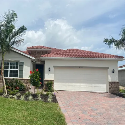 Rent this 4 bed house on 2890 Royal Gardens Avenue in Fort Myers, FL 33916