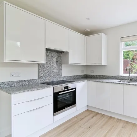 Rent this 3 bed townhouse on Holy Redeemer Parish Hall in Churchmore Road, London
