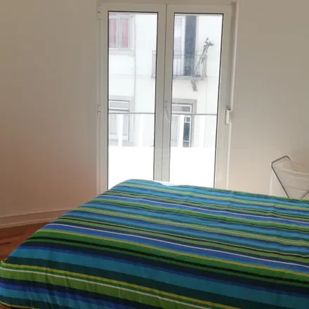 Rent this 4 bed room on Rua Tomás Cabreira in 1600-069 Lisbon, Portugal
